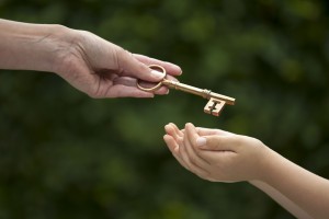 19154622 - mother handing key to daughter