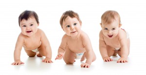 37099474 - cute smiling babies weared diapers crawling isolated on white