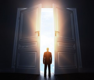 businessman in room with big open door