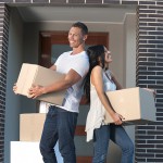 Couple carrying boxes