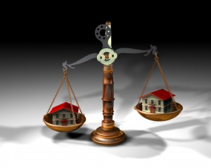 9180619 - 3d illustration of a scale and two houses